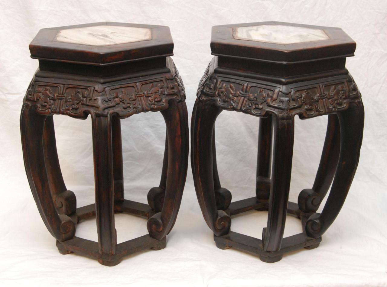 PAIR OF CHINESE CARVED WOODEN MARBLE TOP TABLESPair of Chinese hand carved wooden tables with fitted