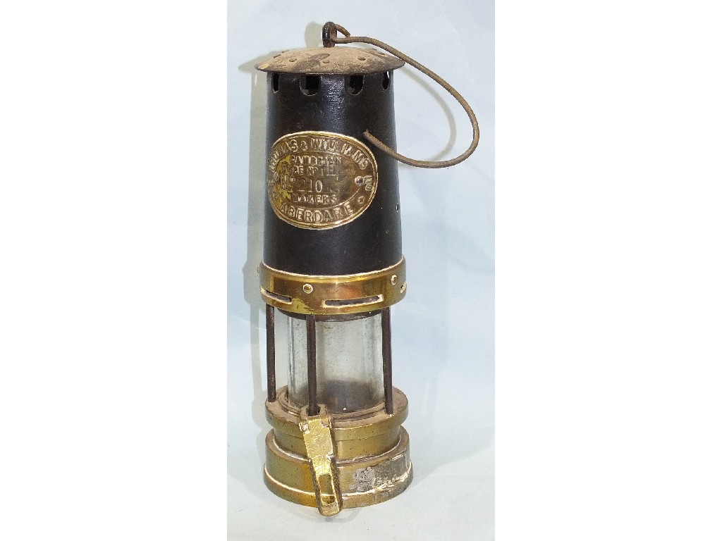 A brass and steel E Thomas & Williams miners lamp, Cambrian type No 1H, no.210, 26cm.