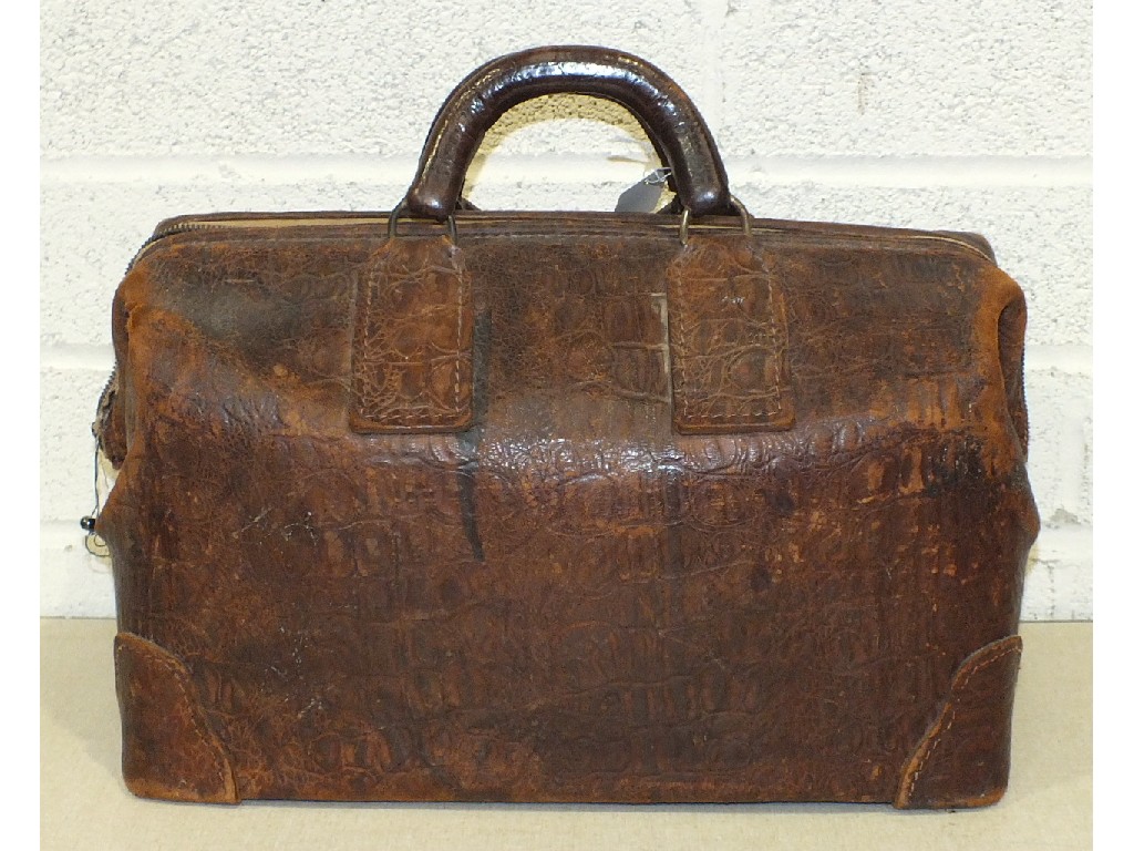 An early-20th century leather `crocodile` holdall with zipped fastening (a/f), by "Airway".
