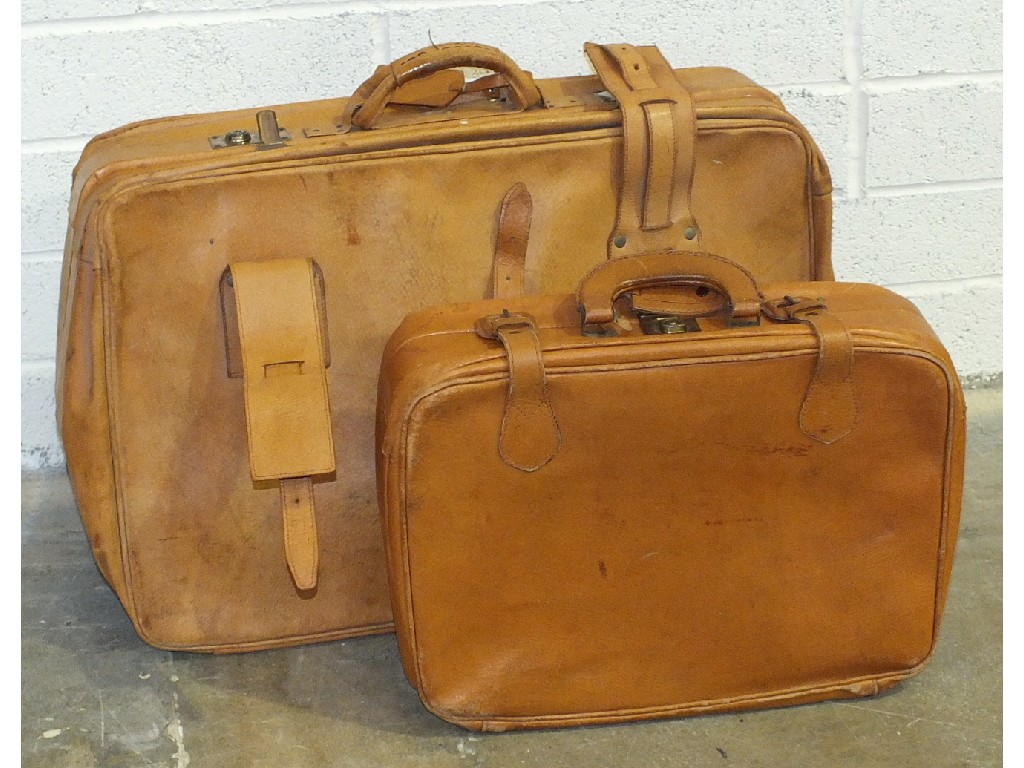 Two pigskin suitcases, one 60 x 40cm, the other 44 x 30cm.