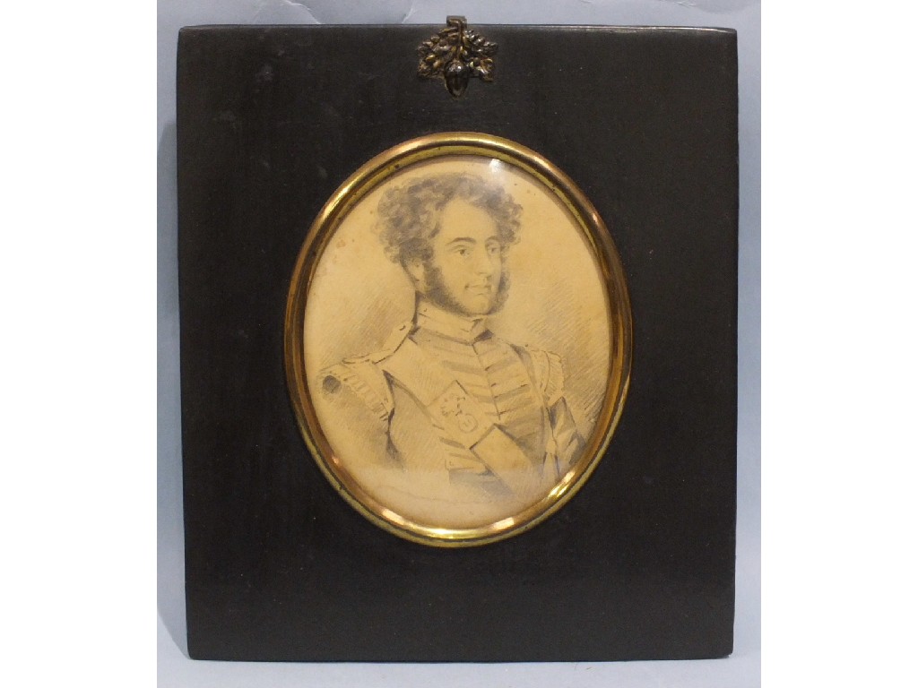 A 19th century pencil miniature portrait of a military officer, oval within a black lacquered frame,