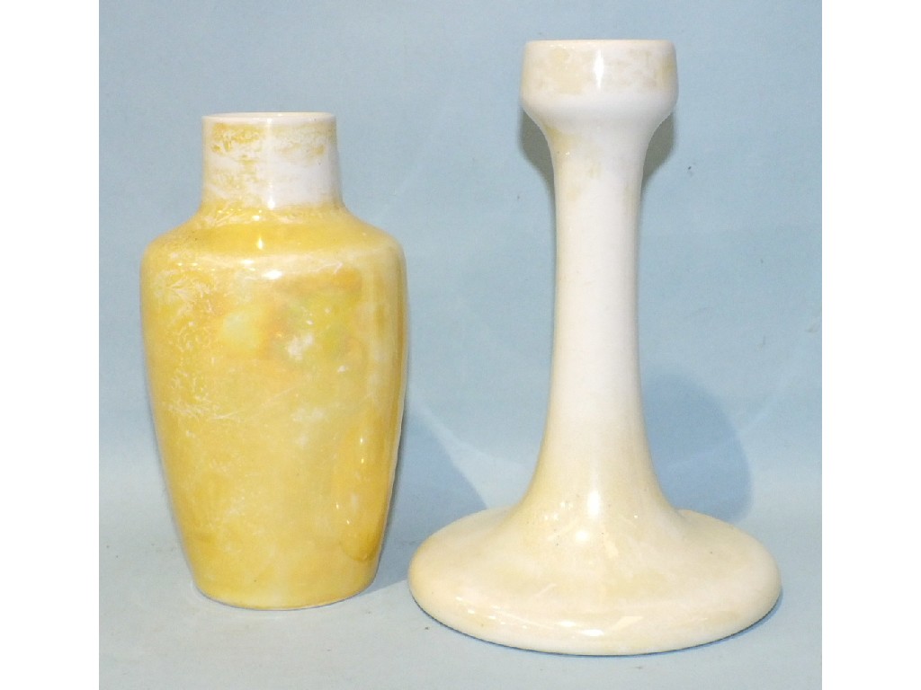 A Ruskin yellow lustred candlestick, impressed mark dated 1914, 17.5cm high and a similar, smaller