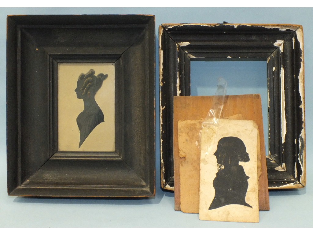 A Victorian silhouette of a young woman wearing ringlets and earrings, 11 x 7cm and another, (2).