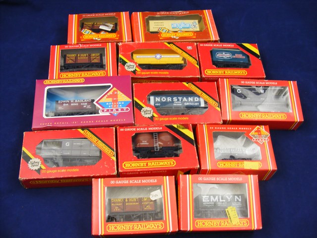 A carton containing 13 boxed Hornby Train wagons to include R237, R105, R018, R206, R6008, R206,