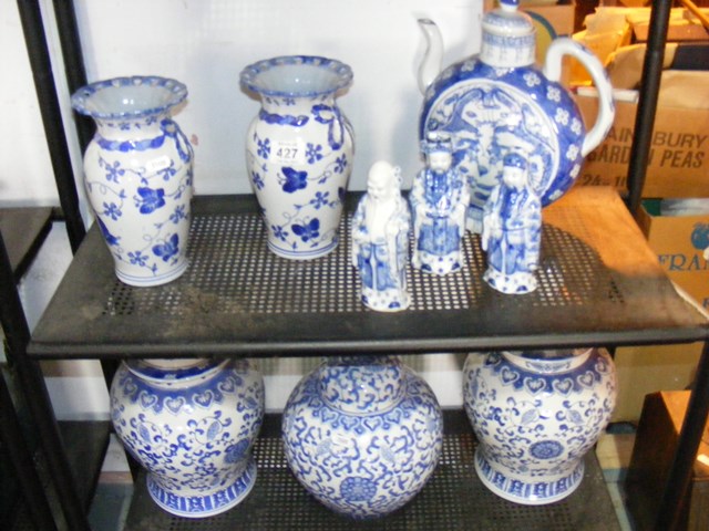 Two shelves of blue and white china