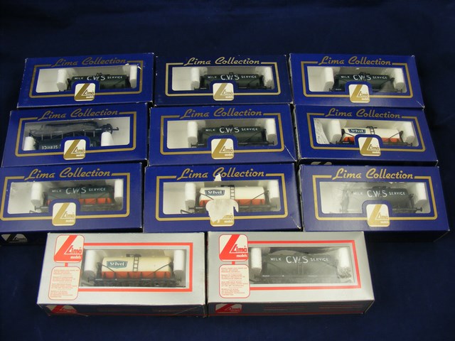 A carton of 11 boxed Lima train wagons mainly milk tanks