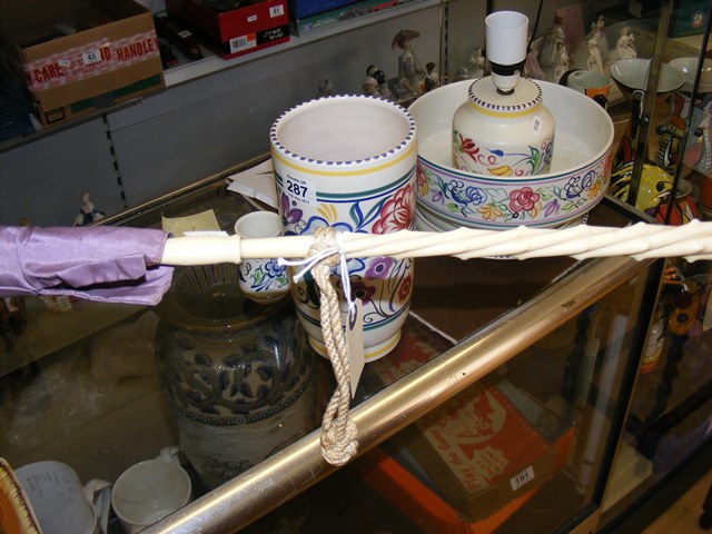 A parasol with ivory? Handle