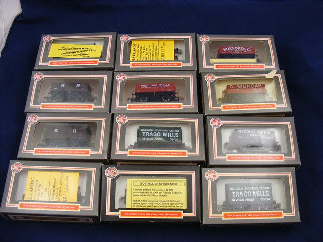 A carton of 12 boxed Dapol train wagons including several limited edition models