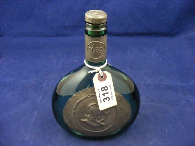 A green glass oval wine bottle