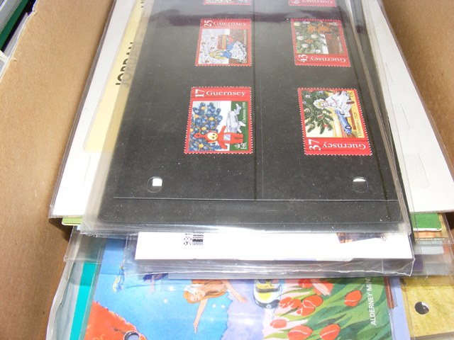 A shoebox containing modern mint incl many Alderney sets in pres packs incl Guernsey £5 Britannia