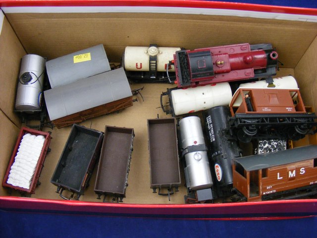 A carton containing a qty of loose Hornby freight wagons and Hornby steam loco