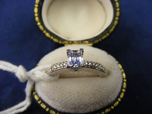 Diamond oblong cut (.84 points) with diamond shoulders 18ct white gold ring est.