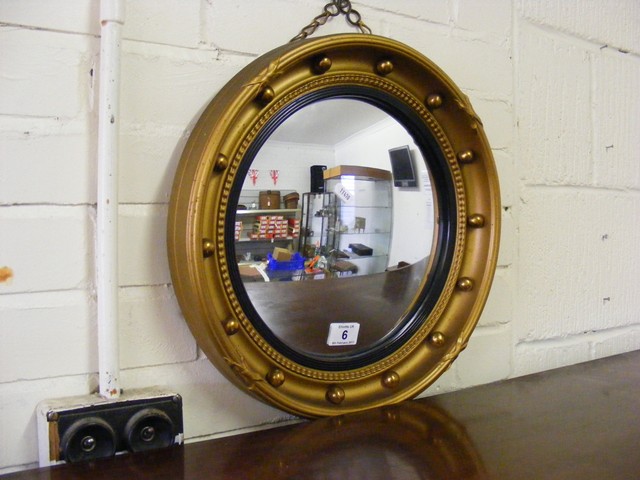 Fish eye mirror in gilt frame est.