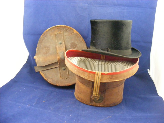 Top hat in leather case marked Floreat Industrial est.