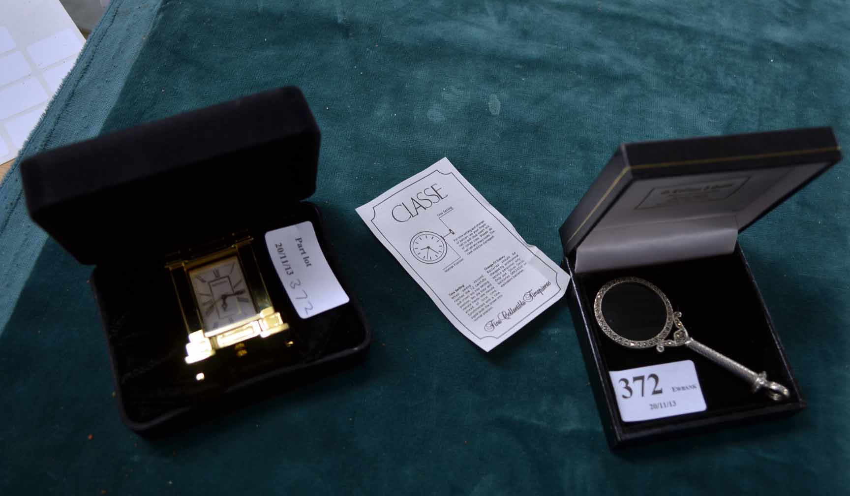 Modern silver magnifying glass and two small clocks, all boxed and unused