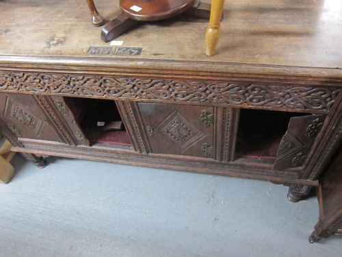 Eighteenth century oak coffer later carved and altered,