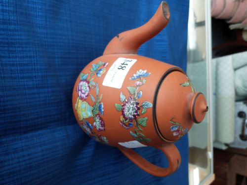 Oriental terracotta teapot with floral decoration