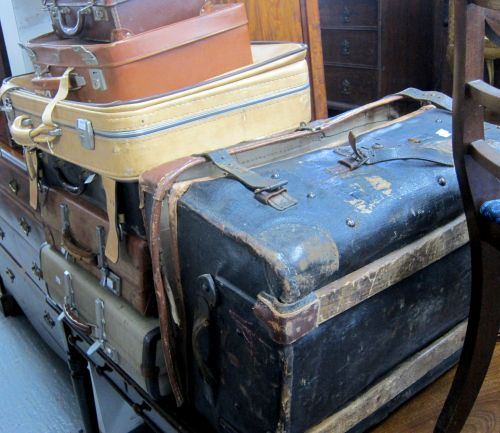 Leather trunk, other luggage and a collection of sporting items including racquets,