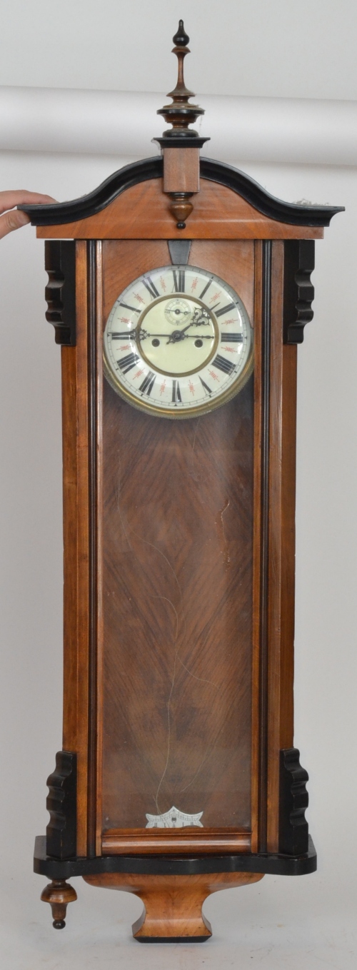 An early 20th Century walnut eight day strike regulator wall clock, Roman numerals to a white dial