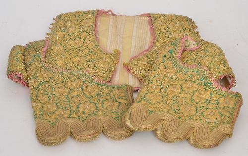 An early 20th Century Indian child`s sequin decorated and embroidered waistcoat together with