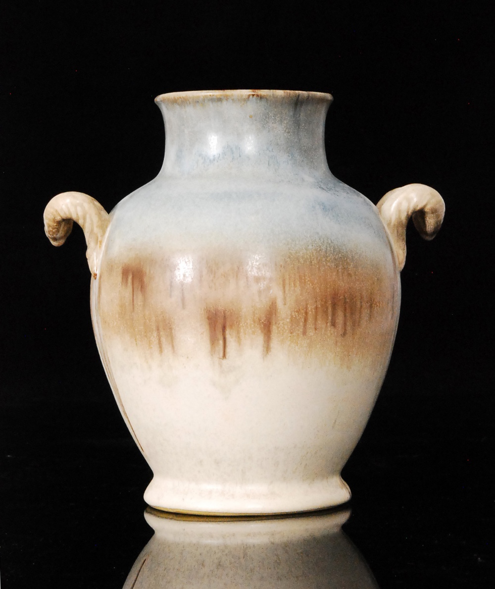 A 20th Century stoneware twin handled vase with faux plated handles, the body decorated with a tonal