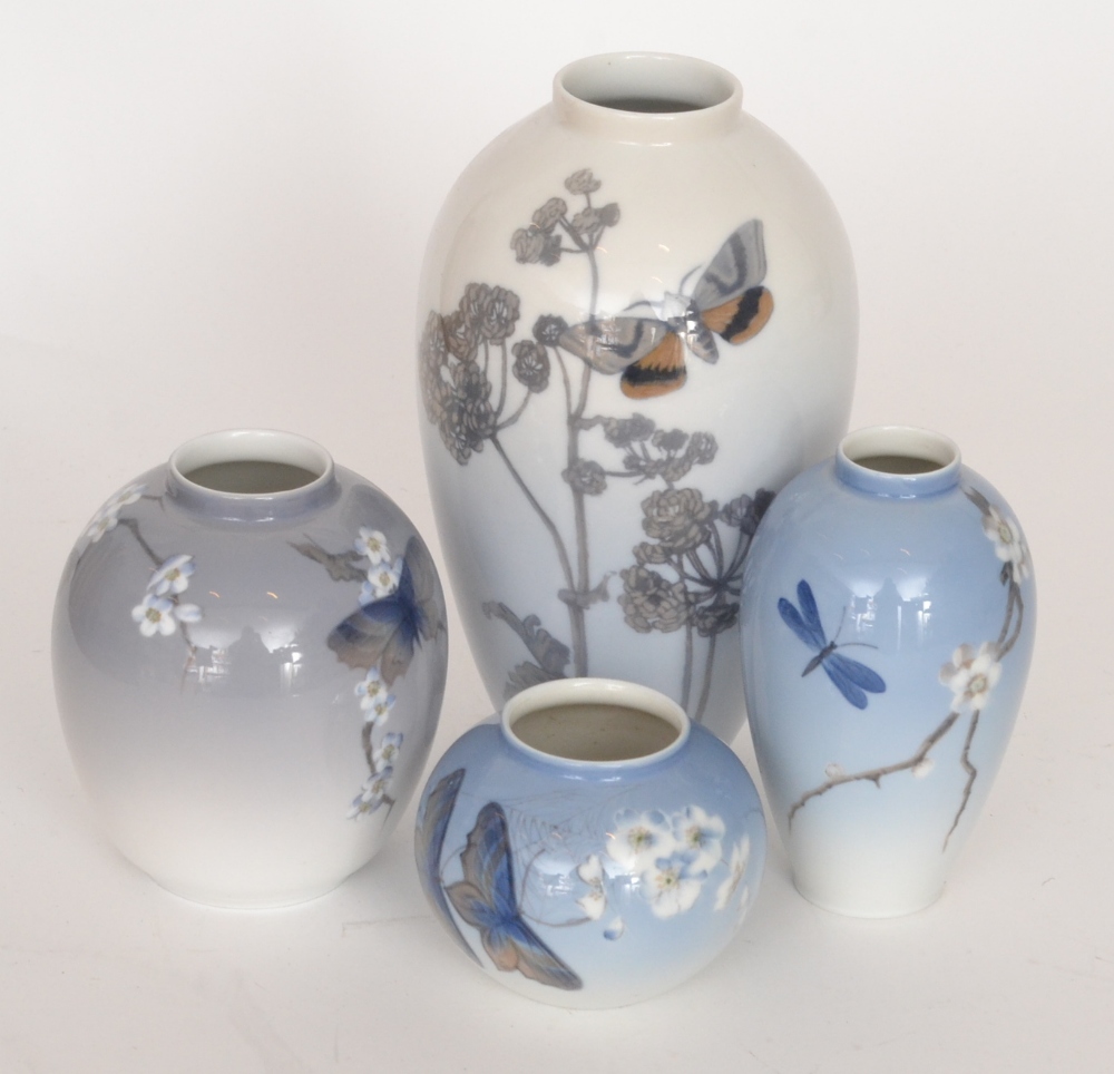 Four assorted Royal Copenhagen vases of varying form, all decorated with handpainted flowers and