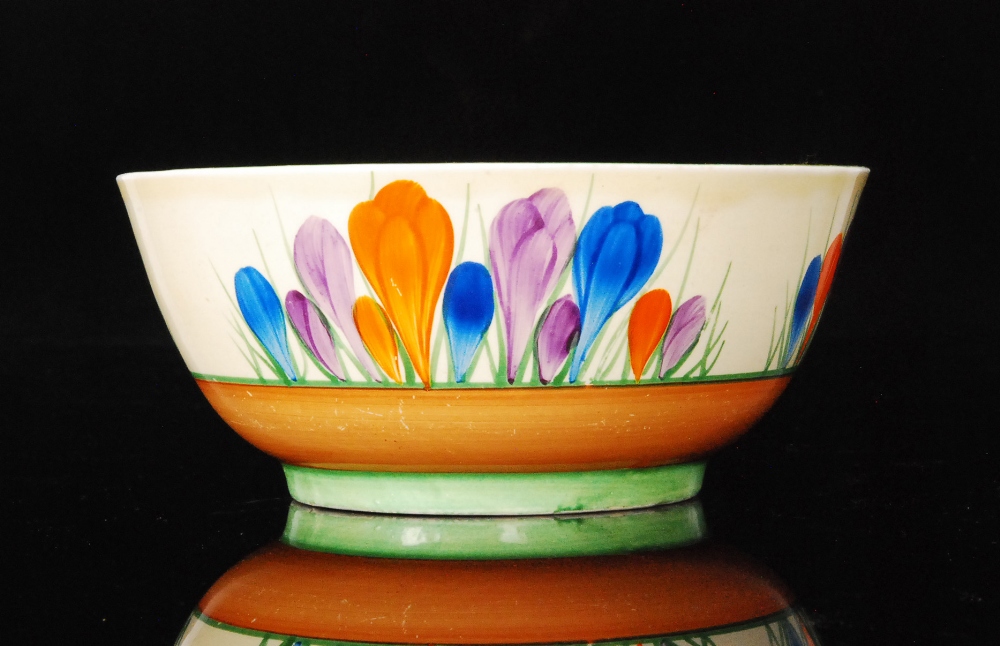 A Clarice Cliff Crocus pattern bowl decorated with three sprays of four brush flowers, Bizarre