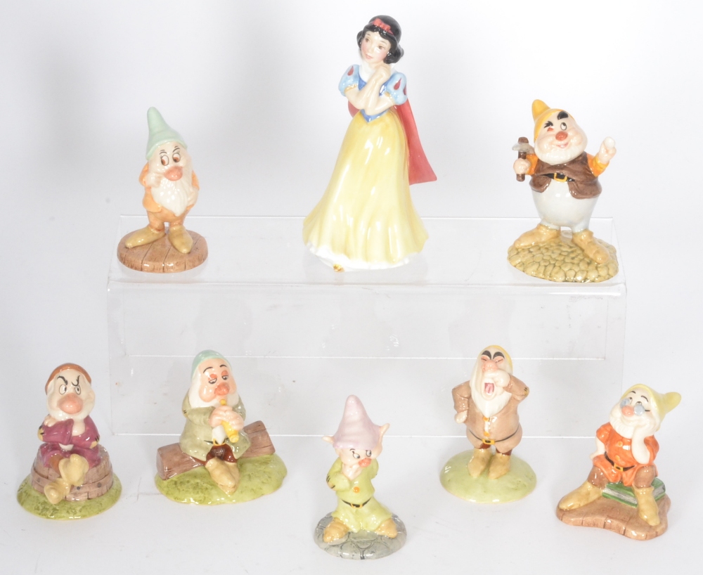 Eight Royal Doulton Snow White and the Seven Dwarfs figurines comprising Sneezy SW14, Grumpy SW11,