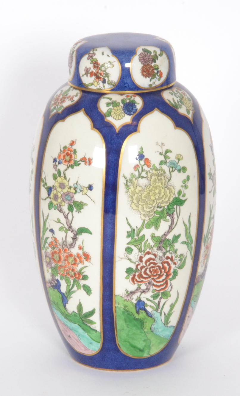 A Wiltshaw and Robinson Carlton Ware elongated ginger jar and cover decorated with cartouche