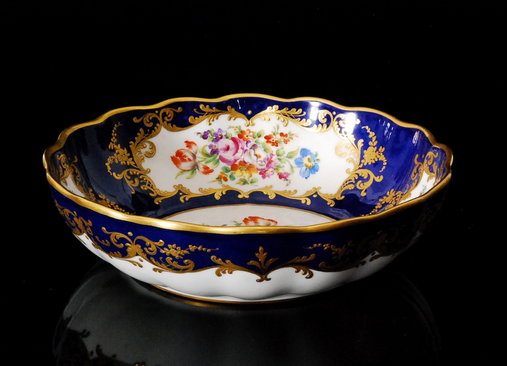 A late 19th to early 20th Century French waved edge bowl decorated to the interior with