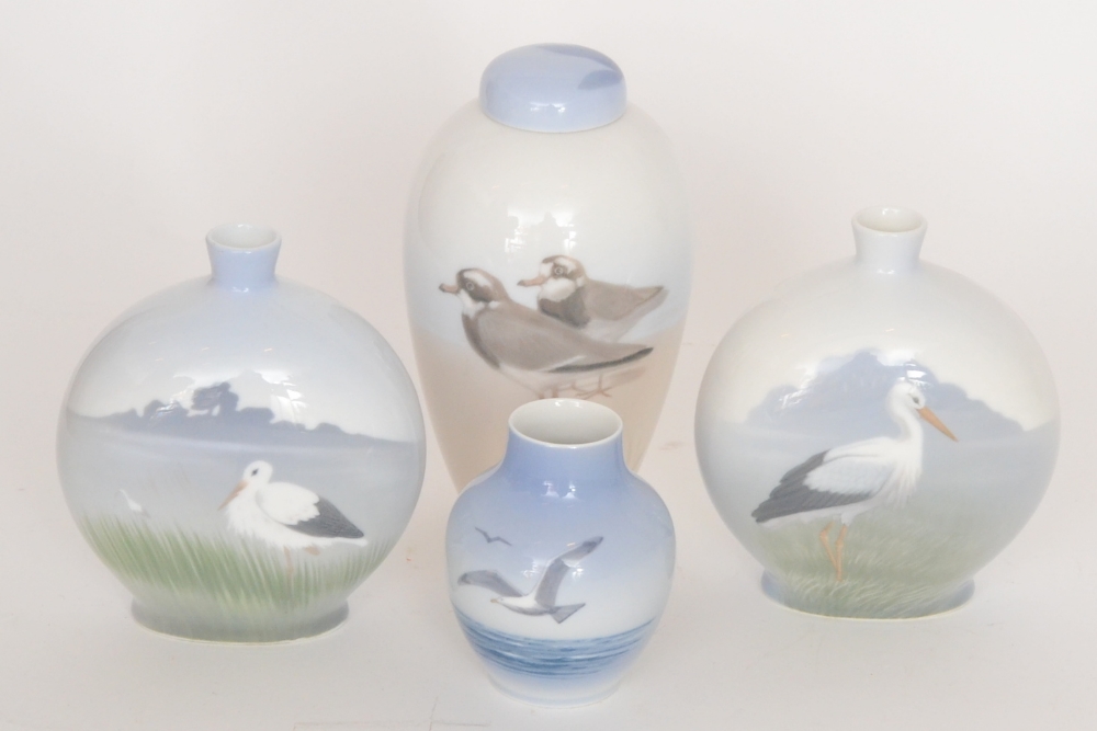 Four assorted Royal Copenhagen vases of varying form, all decorated with handpainted birds