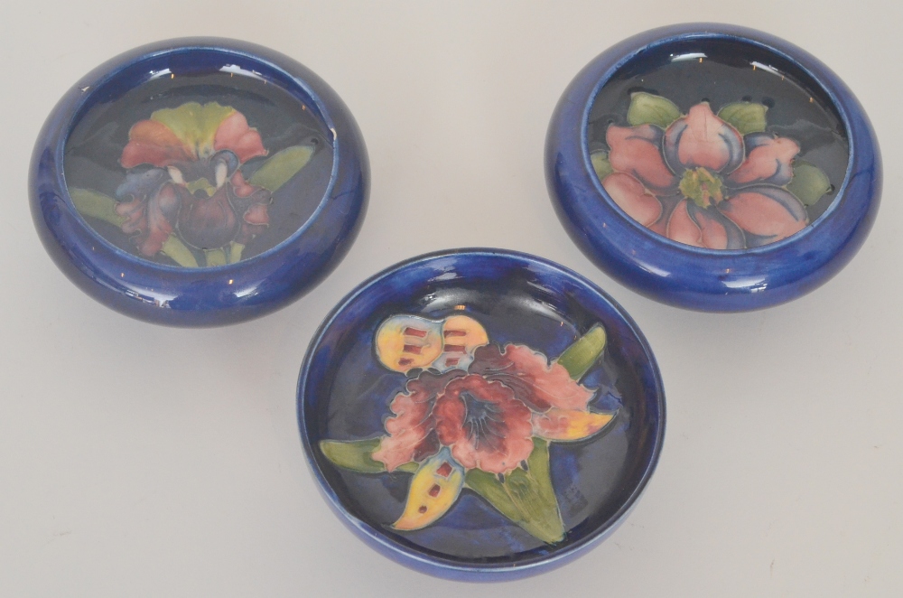 Two Moorcroft roll rim pin dishes, the first in the Clematis pattern, the second in Orchid