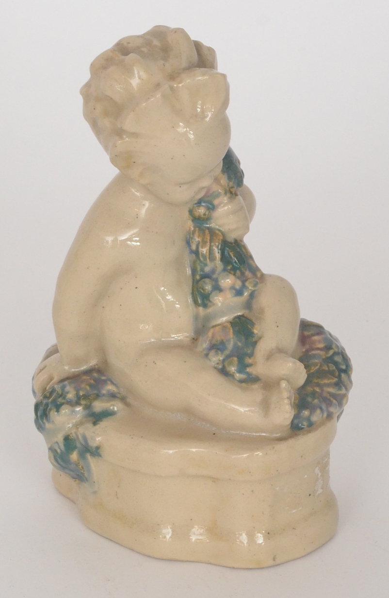 A Carter Stabler & Adams (Poole Pottery) stoneware figure of The Buster Boy modelled by Phoebe