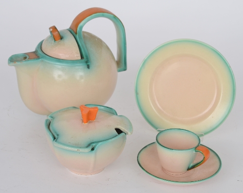 A 1930`s Art Deco teaset comprising teapot, six teacups and saucers, milk jug, two cake plates,