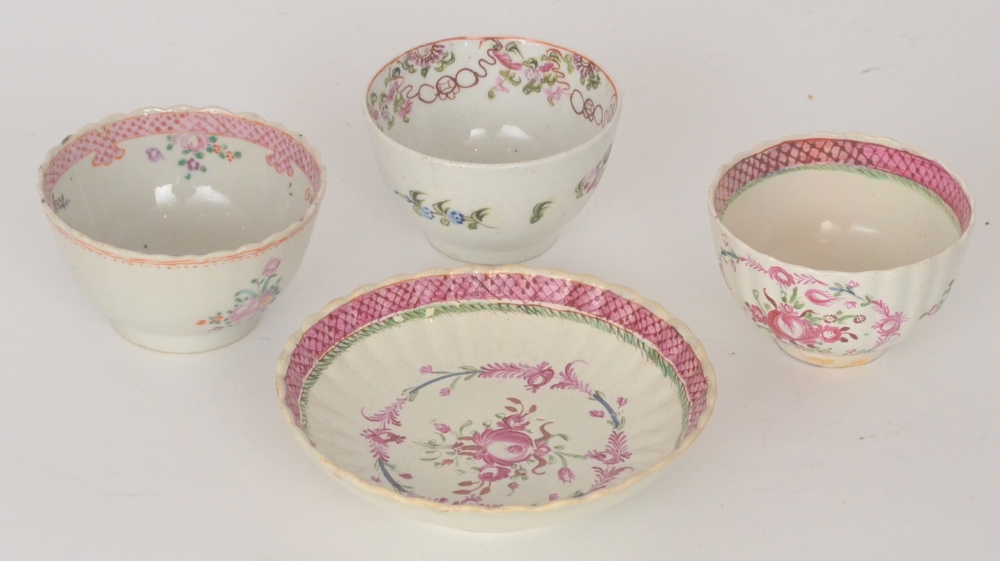 A late 18th Century teabowl and saucer decorated with pink flower heads and garlands together with