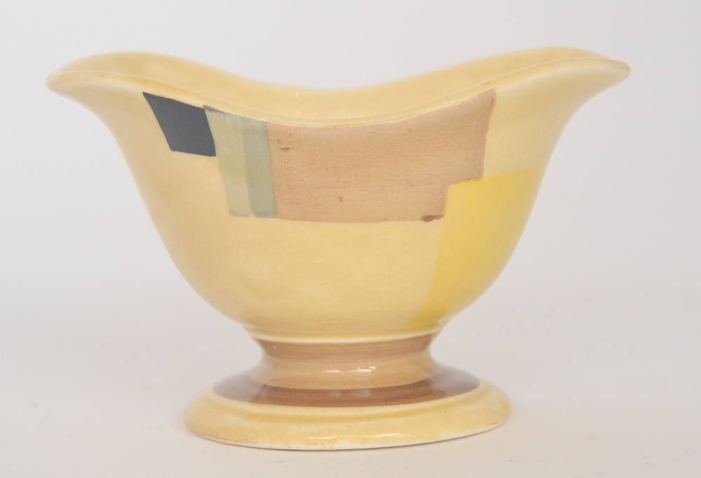 A Susie Cooper `Helmet` shaped sugar basin decorated in the Cubist E110 pattern with yellow, black
