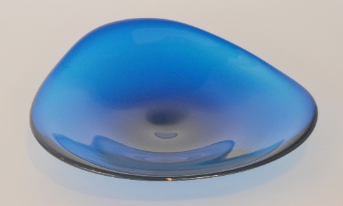 A large post war Scandinavian glass bowl of shallow triform in a deep blue tint, width 33cm.