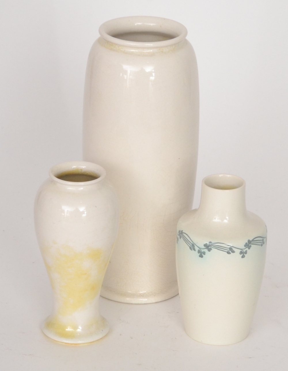 Three pieces of assorted Ruskin Pottery, the first a vase of tapering form, dated 1921, height 27cm,