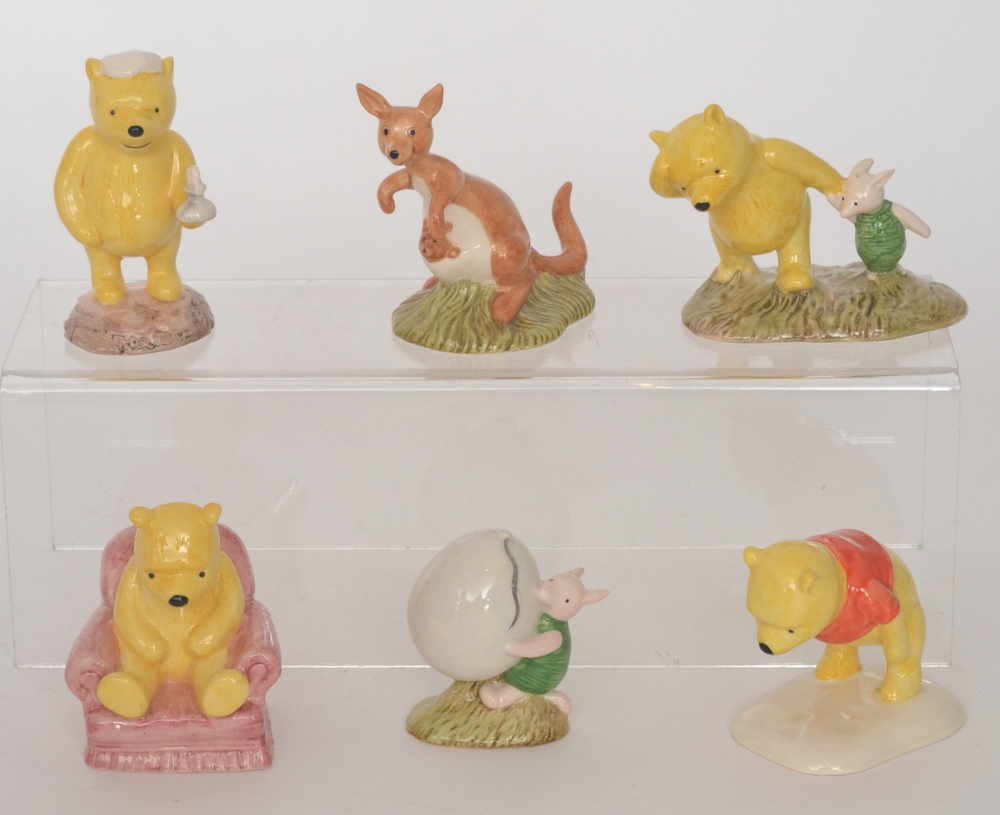 Six Royal Doulton Winnie-the-Pooh figurines comprising Winnie the Pooh in the armchair WP4, Piglet