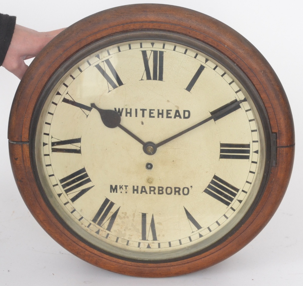 A 19th Century single fusee wall clock with a circular bevelled oak case and painted dial with Roman