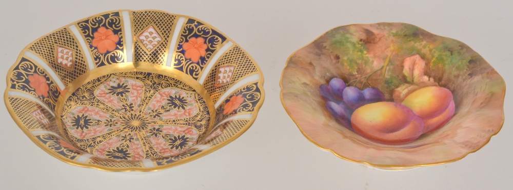 A Royal Worcester handpainted dessert bowl decorated with peaches and red grapes against a mossy