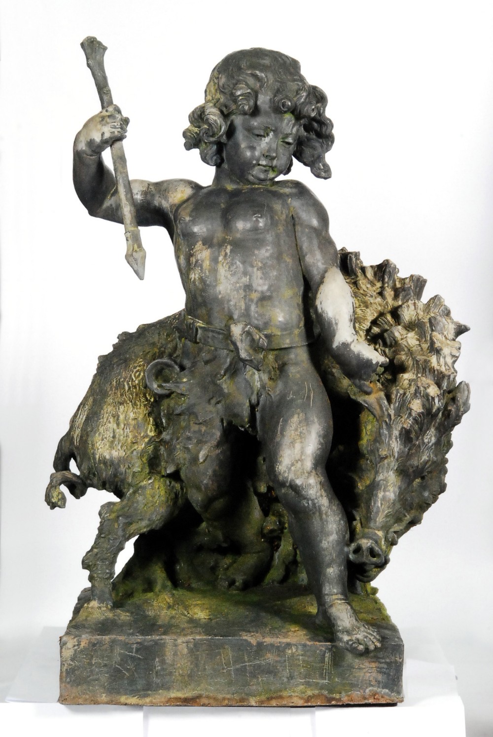 A lead statue by the Bromsgrove Guild - Dryad and Boar, the sculpture depicting a hunter attacking a