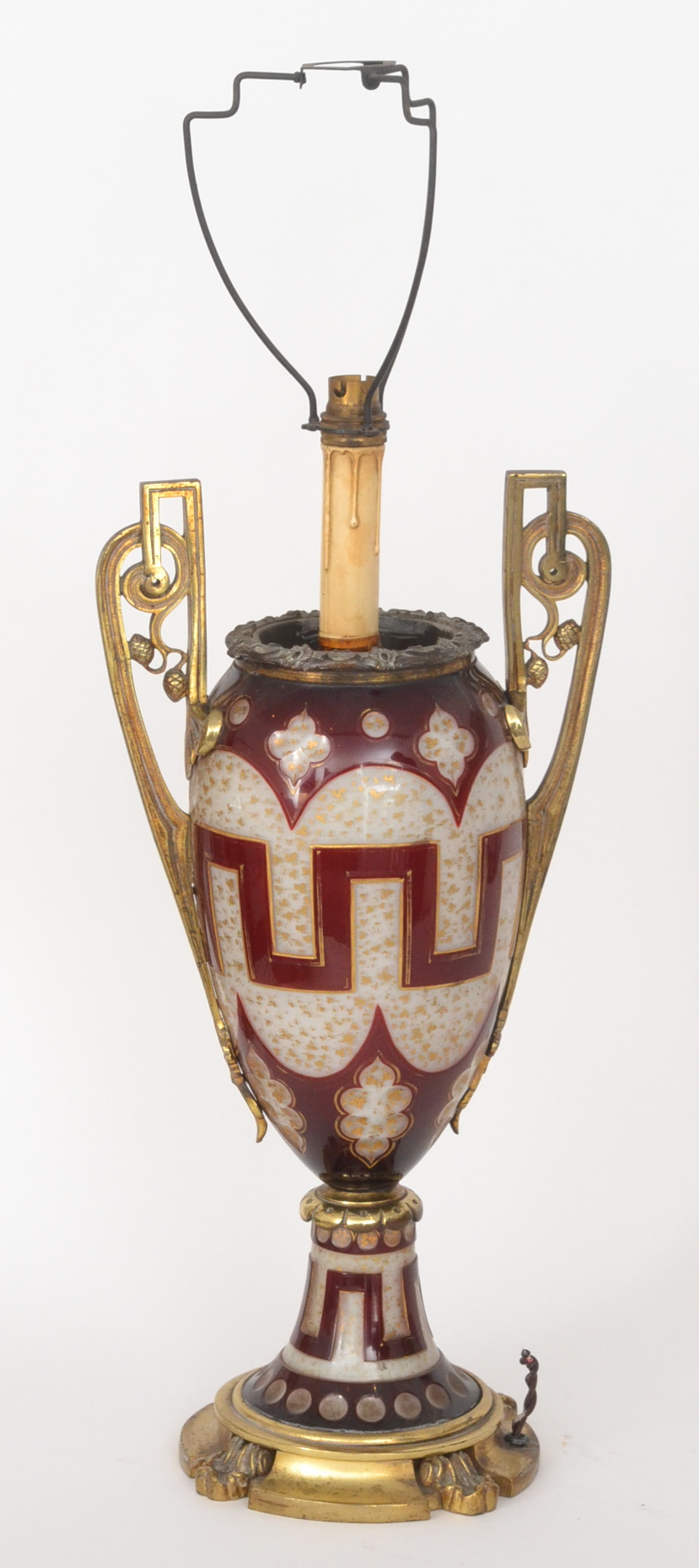 A 19th Century Bohemian Gothic ruby cameo glass and gilt metal mounted twin handled table urn,