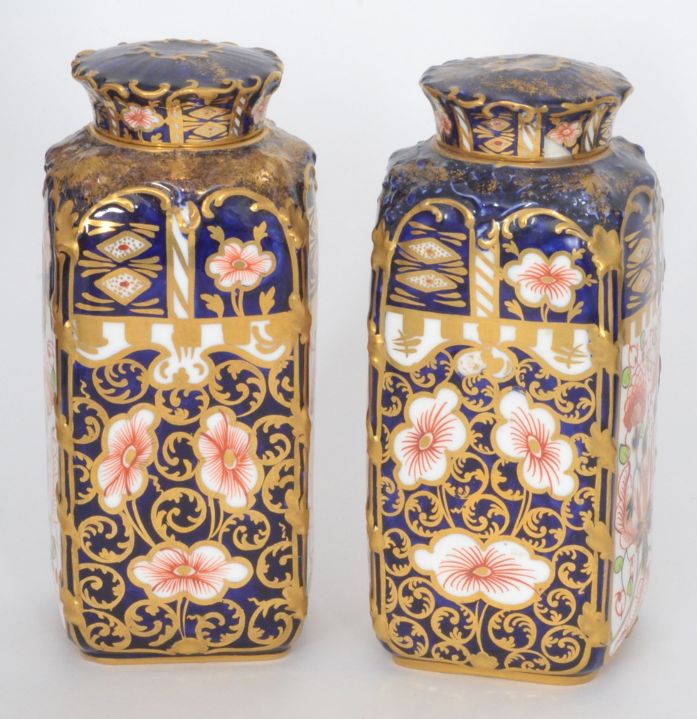 A pair of early 20th Century Royal Crown Derby tea canisters of rectangular form decorated in the