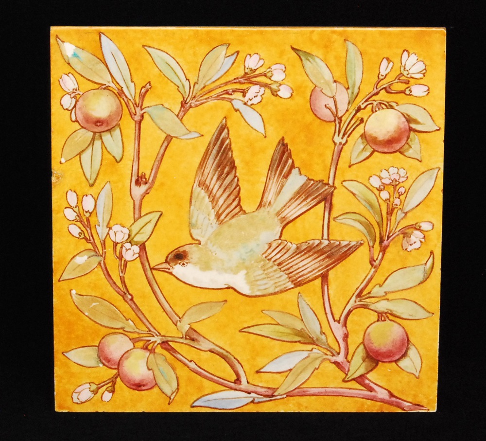 A large late 19th to early 20th Century Mintons tile decorated in the Aesthetic style with a central