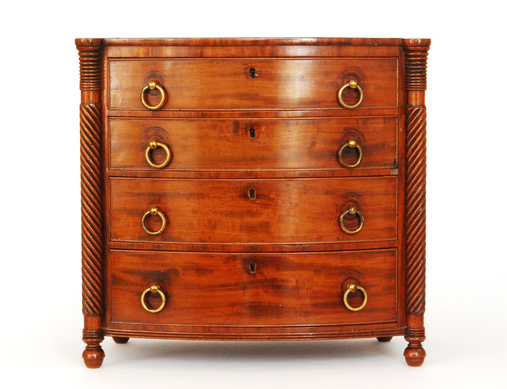 A 19th Century North Counties mahogany apprentice bowfronted chest of drawers, the crossbanded top