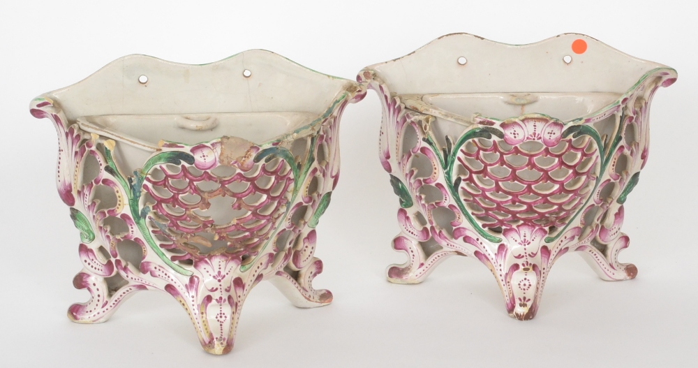 A pair of 19th Century French Faience reticulated wall pockets, each with fish scale front panels in