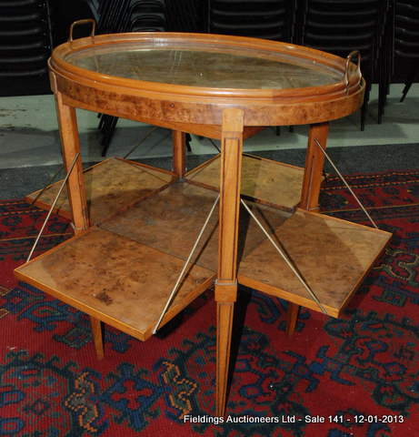 A French 1930`s Art Deco walnut oval tray top occasional or serving table, with a twin handled glass