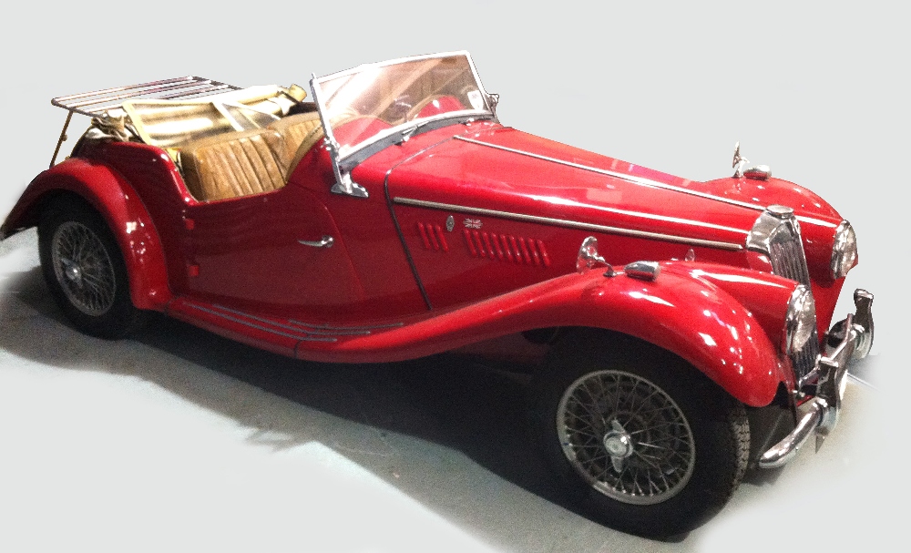 A 1954 MG TF 1500 Roadster in red, registration UVK 40, 1250cc petrol engine No 5682, engine No