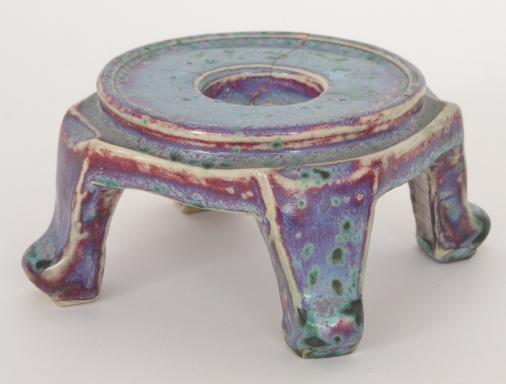 A Ruskin Pottery high fired stand in the Oriental taste raised to four scroll feet decorated with